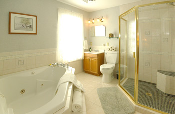Deluxe bathroom features an oversize Jacuzzi tub